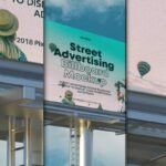 Street advertising billboard mockup featuring a woman with a hat and hot air balloons, with text "Street Advertising Billboard Mockup" on a teal background.