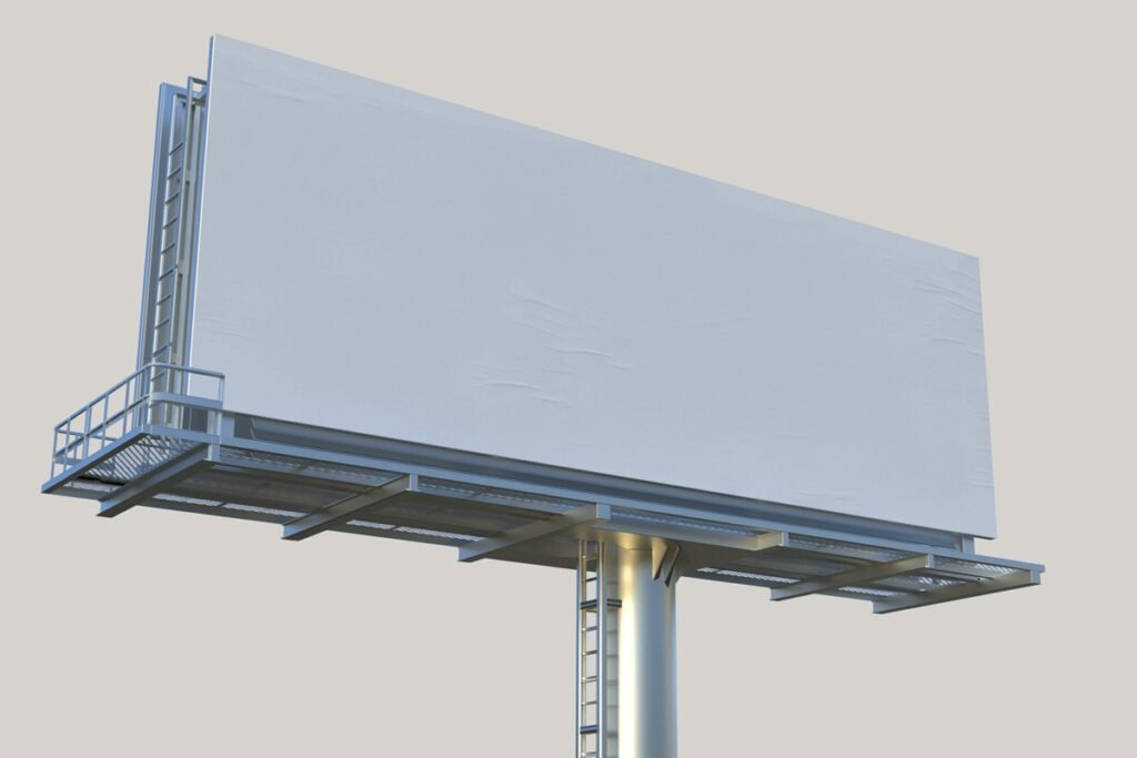 Blank large outdoor billboard mockup with a white canvas and metal structure against a plain light background, ready for advertising.