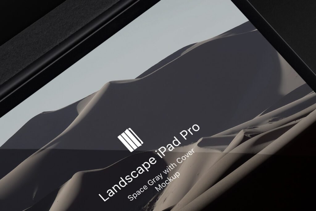 Close-up of an iPad Pro in a dark protective case displaying a landscape image of sand dunes and text "Landscape iPad Pro Space Gray with Cover Mockup."