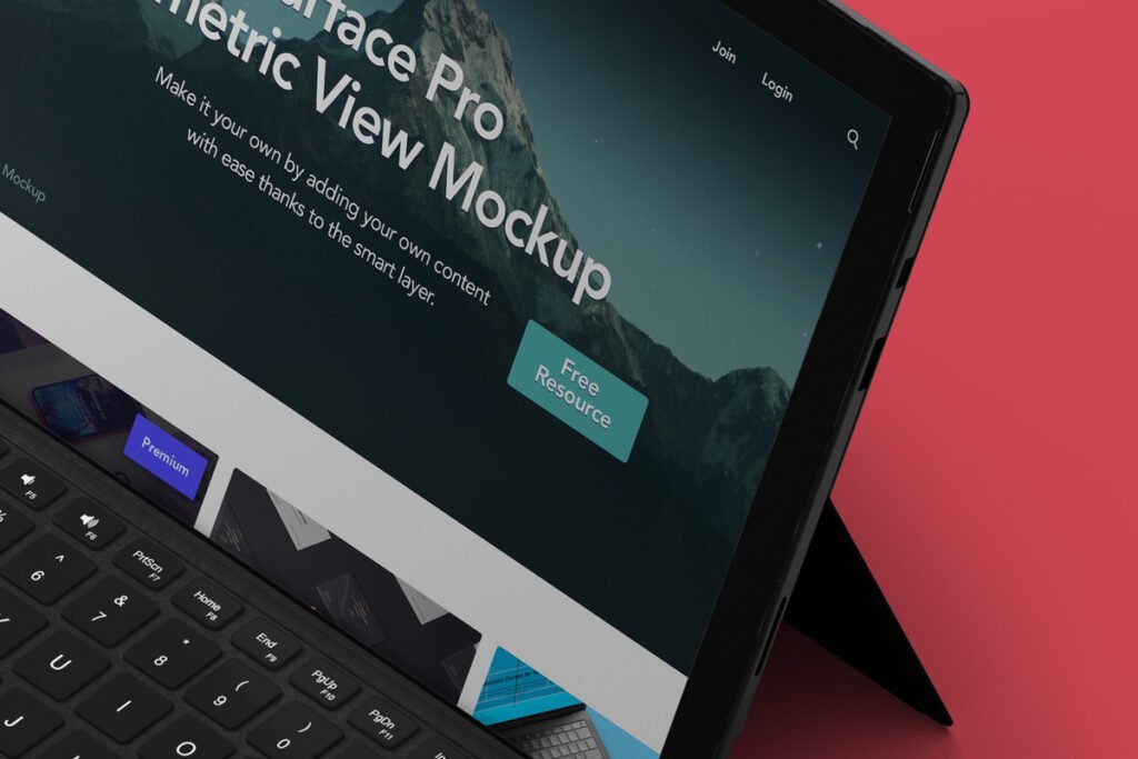 Close-up of a laptop screen displaying "Surface Pro Isometric View Mockup" over a dark mountain landscape with a "Free Resource"
