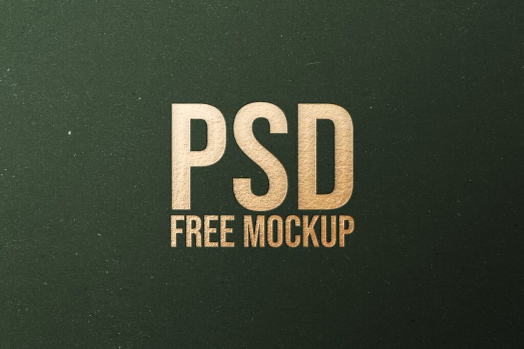 A gold pressed "PSD FREE MOCKUP" text on a dark green textured background.