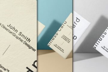 Three dynamic views of a floating Business Card Mockup PSD, showcasing a white business card with embossed text from different angles and backgrounds.