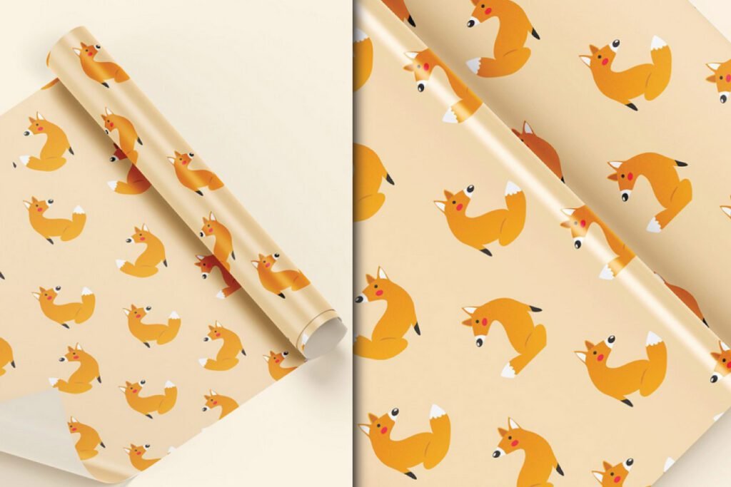 Gift Packaging Wrapping Paper Mockup PSD showing two rolls of light orange paper with a repeating pattern of cartoon foxes; one roll is partially unrolled.