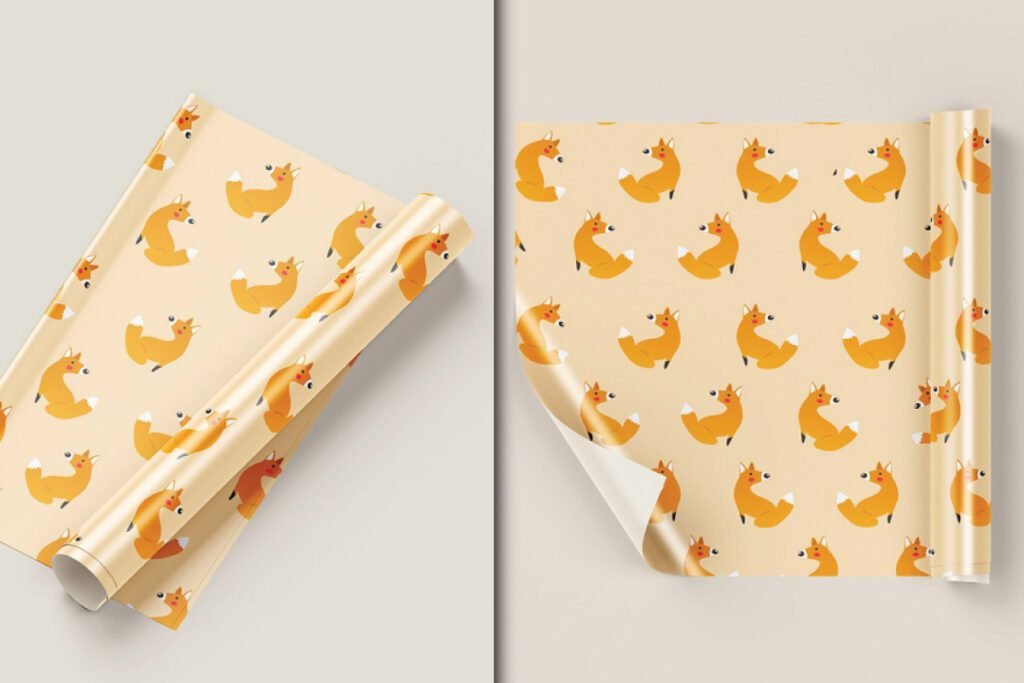 Gift Packaging Wrapping Paper Mockup PSD displaying two rolls of light orange paper patterned with cartoon foxes, one partially unrolled from a corner and the other from the side.