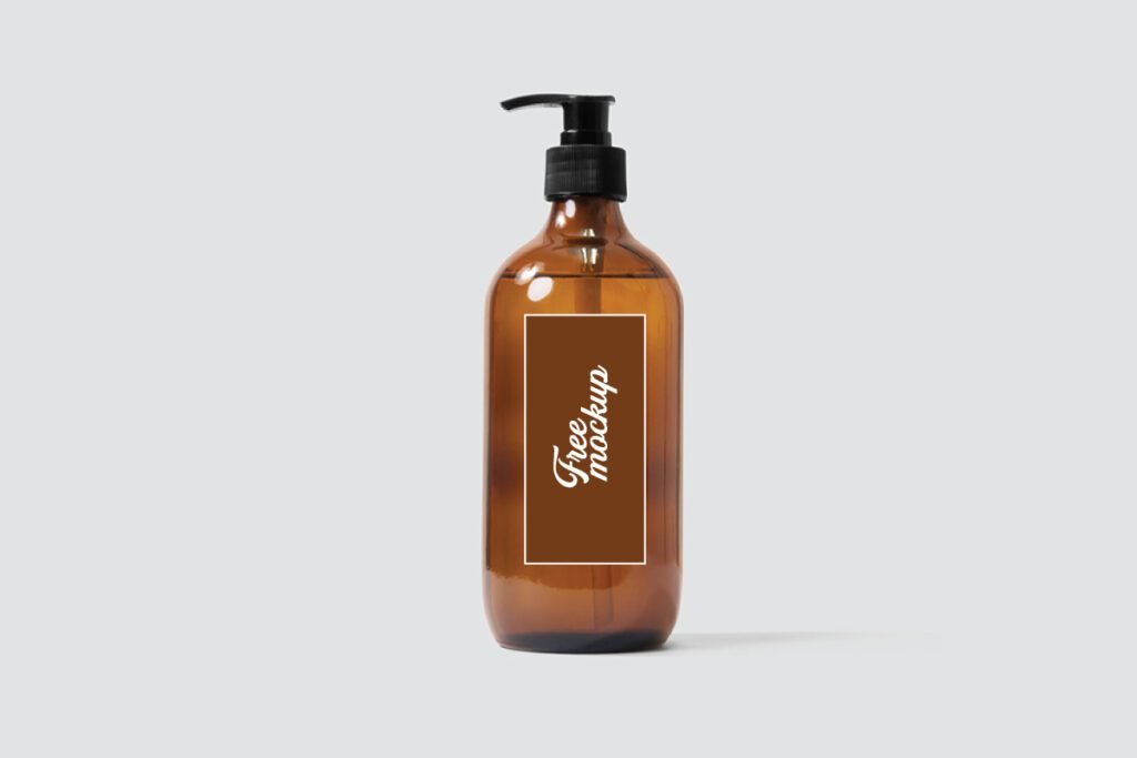 Amber Glass Dispenser Bottle Label Mockup PSD displaying three views of an amber glass bottle with a black pump dispenser. One bottle has a brown label with white Free mockup text, another is blank, and the third has a white label with a black PSD FREEMOCKUP box logo.