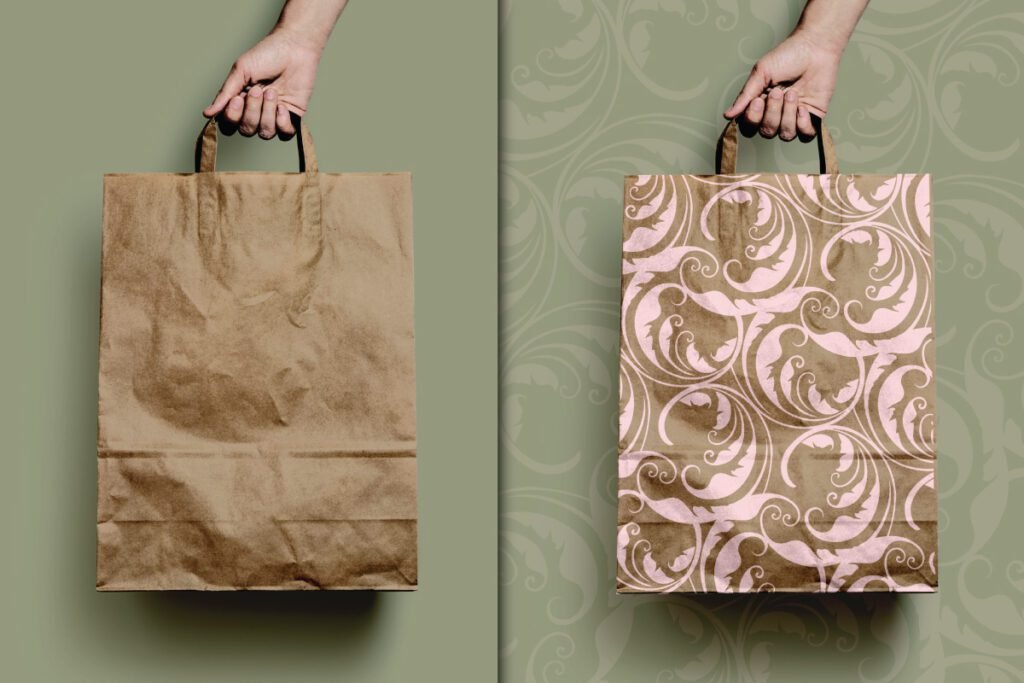 Best Zero Waste Eco Paper Bag Mockup PSD displays a hand holding a plain brown paper bag against a solid green background. On the right, another hand holds a brown paper bag with a light pink ornate pattern, set against a patterned green background.