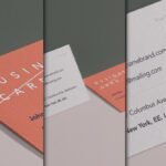 A close-up, angled view of two business cards in a wall perspective mockup. One card is salmon pink with "BUSINESS CARD" embossed, and the other is off-white with contact details.
