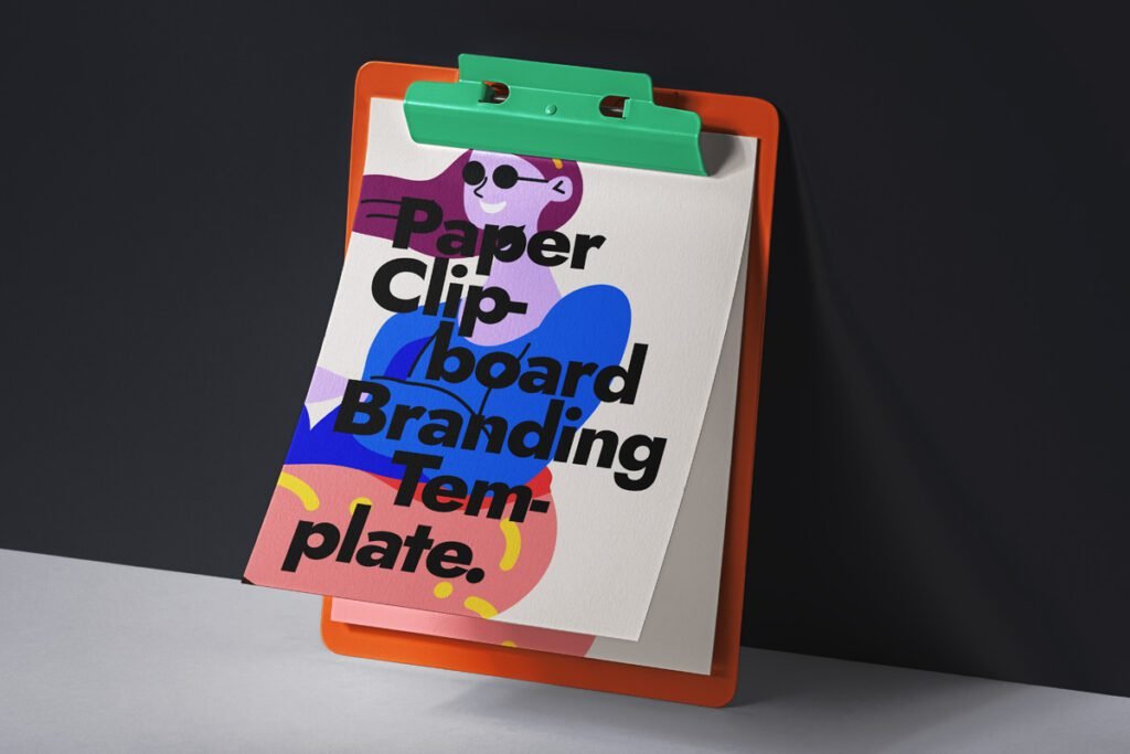An orange clipboard with a green clip holds a white paper featuring a stylized illustration of a woman and the bold text "Paper Clipboard Branding Template", leaning against a dark gray wall.
