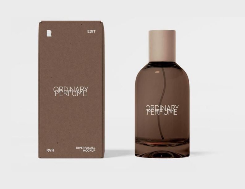 A sophisticated perfume bottle mockup featuring a dark amber glass bottle with "ORDINARY PERFUME" branding, placed next to its matching brown, minimalist packaging box on a light grey background.