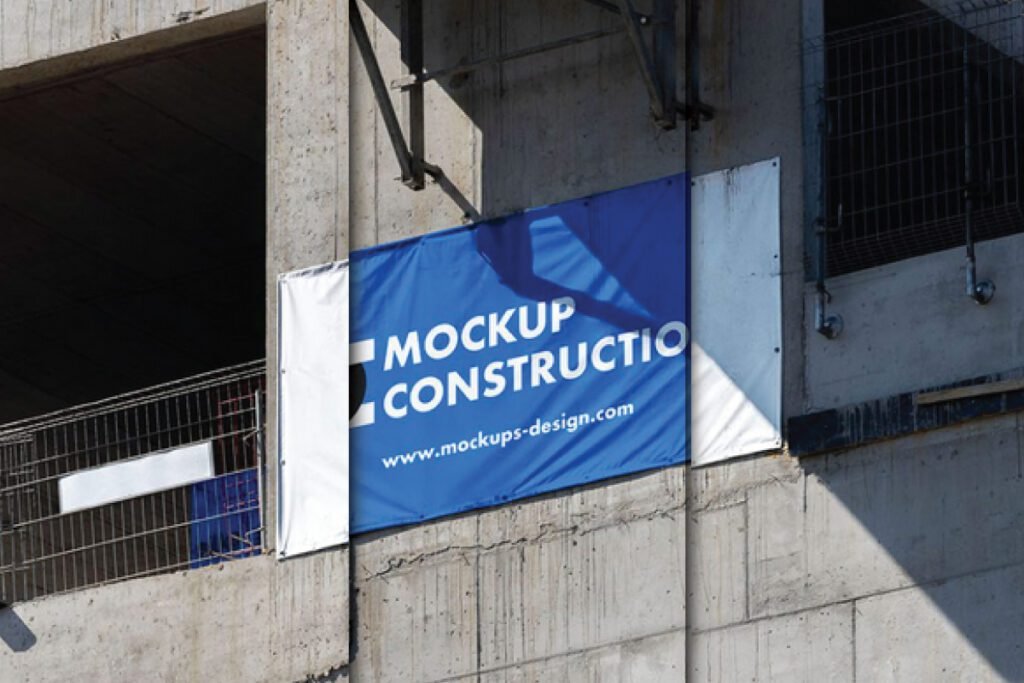 Customizable Outdoor Construction Banner Mockup PSD attached to a building under construction.