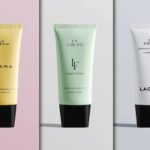 Three cosmetic Cream Tubes Mockup are displayed vertically. From left to right: a yellow tube for "QUARA" CC Cream, a light green tube for "Laura Faust" CC Cream, and a white tube for "LAORIV" CC Cream. All tubes have black caps.