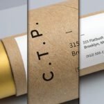 Realistic Cardboard Foil Tube Packaging Mockup PSD showing three views of a brown cardboard tube with a white label for an address, and gold foil visible at one end.