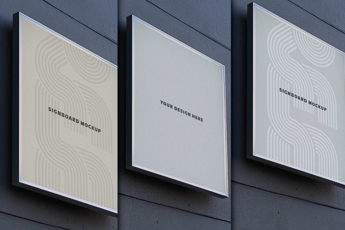 Three square hotel signboard mockups are mounted on a dark textured wall.