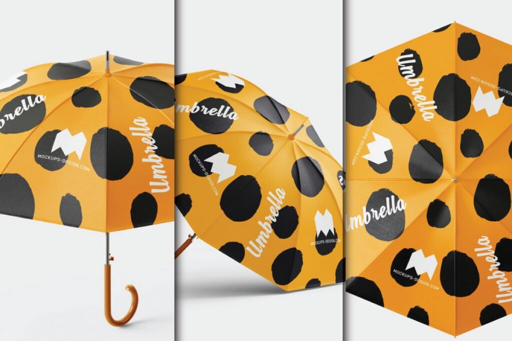 Three views of an open yellow umbrella mockup psd with black spots and the word Umbrella printed in white, showcasing its design from different angles.