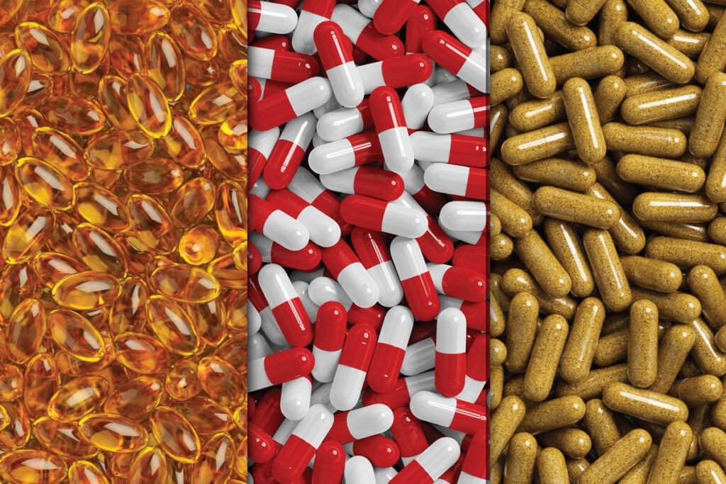 Pharmaceutical capsule and tablet mockup PSD showing three columns of different pills. The left column contains yellow oval gel capsules, the center column has red and white capsules, and the right column features light brown elongated capsules.