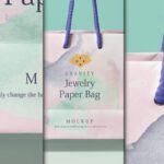 A multi-panel Shopping Bag Mockup featuring a pink "Jewelry Paper Bag" with watercolor designs and purple rope handles. The central panel shows the full bag, while side panels offer close-ups of the design.