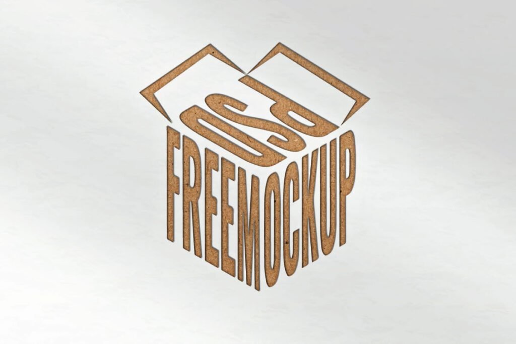 A craft paper with debossed effect logo mockup shows the text PSD FREEMOCKUP arranged in a cube shape. The logo has a brown, pressed-in texture on a light paper background.