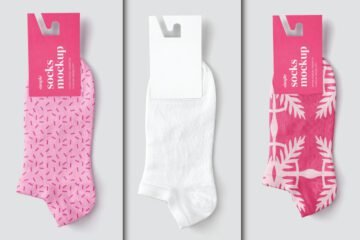 Three socks with labels, one with a pink sprinkle pattern, one white, and one with a pink patterned design.